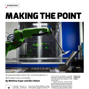 A green robotic arm places an object onto a conveyor in a factory setting, illustrating automation technology in distribution.