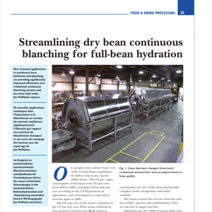 Industrial food processing machinery in a factory setting, with large metal equipment arranged in a row for bean blanching and hydration.
