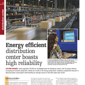 A woman sits at a computer in a warehouse with conveyor belts, boxes, and shelves, illustrating an energy-efficient distribution center in operation.
