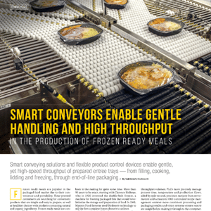 Frozen ready meals in trays move along automated conveyor belts in a food processing facility, demonstrating efficient and gentle product handling for packaging.